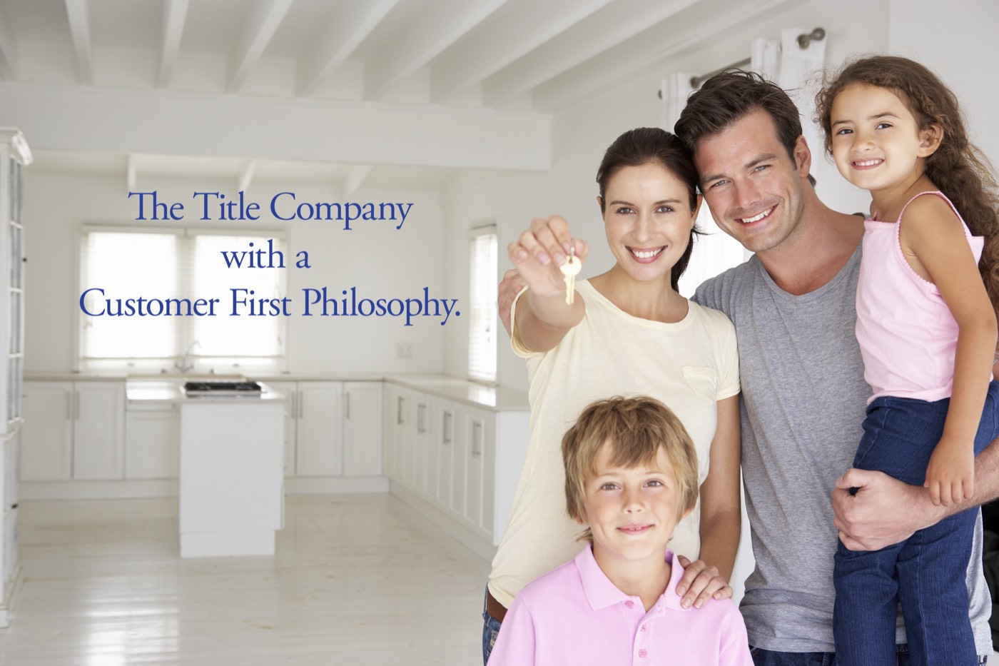 A family holding the keys to their new home. The Title Company with a Customer First Philosophy.